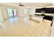 Open concept floor plan featuring a kitchen, dining, and living area with access to a screened in porch at 3333 Wauseon Dr, St Cloud, FL 34772