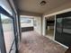 Screened in patio with brick pavers, providing access to the kitchen through sliding glass doors at 3333 Wauseon Dr, St Cloud, FL 34772