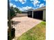 Large brick patio with screened-in porch offers a delightful outdoor living space at 3333 Wauseon Dr, St Cloud, FL 34772