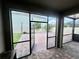 View of patio through screened windows overlooking backyard at 3333 Wauseon Dr, St Cloud, FL 34772