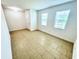 Bright, airy room with tile flooring, white walls, and natural light from two windows at 3333 Wauseon Dr, St Cloud, FL 34772