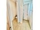 A toilet room featuring neutral tile flooring with white trim and doorways at 3333 Wauseon Dr, St Cloud, FL 34772