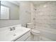 Clean bathroom, featuring a bathtub and marble tile at 3362 Janet St, Apopka, FL 32712