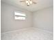 Bedroom with ceiling fan and marble-look tile flooring at 3362 Janet St, Apopka, FL 32712