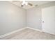 Simple bedroom with ceiling fan and wood-look floors at 3362 Janet St, Apopka, FL 32712