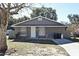 Gray single story house with a white door and attached garage at 3362 Janet St, Apopka, FL 32712