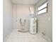 Laundry area with water heater and tile floor at 3362 Janet St, Apopka, FL 32712