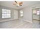 Living room with gray walls, wood-look floors, and kitchen view at 3362 Janet St, Apopka, FL 32712