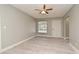 Living room with gray walls, wood-look floors, and exterior door at 3362 Janet St, Apopka, FL 32712