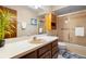 Bathroom with shower/tub combo, vanity, and a linen closet at 3425 Suzette Dr, Kissimmee, FL 34746