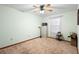 Bright bedroom with carpeted floor and a window at 3425 Suzette Dr, Kissimmee, FL 34746