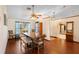 Bright dining area with hardwood floors and a rustic wooden table at 3425 Suzette Dr, Kissimmee, FL 34746