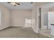 Bright bedroom with neutral walls and ceiling fan at 3593 Conroy Rd # 413, Orlando, FL 32839