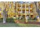 Building facade with arched entryways and landscaping at 3593 Conroy Rd # 413, Orlando, FL 32839