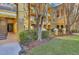 Building entrance with walkway, stairs, and landscaping at 3593 Conroy Rd # 413, Orlando, FL 32839