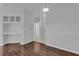 Simple dining area with hardwood floors and built-in shelving at 3593 Conroy Rd # 413, Orlando, FL 32839