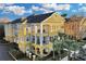 Attractive yellow 3-story building with balconies and landscaping at 3593 Conroy Rd # 413, Orlando, FL 32839