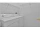 Bright laundry room, featuring washer, dryer, and ample shelving at 3593 Conroy Rd # 413, Orlando, FL 32839