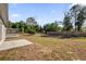 Large backyard with wooden fence and patio at 3650 Se 140Th Pl, Summerfield, FL 34491