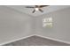 Bright bedroom with wood-look floors, ceiling fan, and window at 3650 Se 140Th Pl, Summerfield, FL 34491