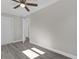 Bedroom with grey flooring and double doors to another room at 3650 Se 140Th Pl, Summerfield, FL 34491