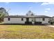 Newly renovated single story home with landscaped lawn and driveway at 3650 Se 140Th Pl, Summerfield, FL 34491