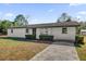 Newly renovated single story home with landscaped lawn and driveway at 3650 Se 140Th Pl, Summerfield, FL 34491