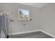 Bright laundry room with vinyl flooring and water heater at 3650 Se 140Th Pl, Summerfield, FL 34491