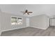 Spacious living area with vinyl flooring and ceiling fan at 3650 Se 140Th Pl, Summerfield, FL 34491