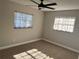 Spacious bedroom with neutral walls, ceiling fan, and ample natural light at 407 Parson Brown Way, Longwood, FL 32750