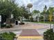 Landscaped entrance to community with signage and brick pavers at 407 Parson Brown Way, Longwood, FL 32750