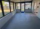 Large screened porch with concrete flooring, providing a relaxing outdoor space at 407 Parson Brown Way, Longwood, FL 32750