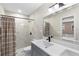 Modern bathroom with a walk-in shower, double vanity, and stylish tile at 43 Dahlia Dr, Debary, FL 32713