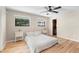 Bright bedroom with light flooring, a queen bed, and ample natural light at 43 Dahlia Dr, Debary, FL 32713