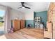 Bright playroom with two storage units, a desk and playful decor at 43 Dahlia Dr, Debary, FL 32713