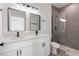 Modern bathroom with double vanity, large shower, and gray tile at 4774 Sw 152Nd Ln, Ocala, FL 34473