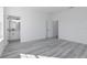 Bright bedroom with gray flooring and en-suite bathroom at 4774 Sw 152Nd Ln, Ocala, FL 34473