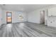 Bright living room featuring gray vinyl plank flooring at 4774 Sw 152Nd Ln, Ocala, FL 34473