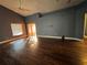 Living room with hardwood floors and sliding glass doors at 551 Lake Charles Dr, Davenport, FL 33837