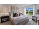 Large main bedroom with plush bed and tranquil window view at 5808 Galloping Dr, Apopka, FL 32712