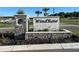 WindRose community entrance sign with stone pillars at 5847 Galloping Dr, Apopka, FL 32712