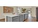 Kitchen island with white countertop and gray cabinets at 5847 Galloping Dr, Apopka, FL 32712