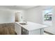 White kitchen island with a double sink and quartz countertop at 5855 Galloping Dr, Apopka, FL 32712