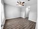 Bright bedroom with wood-look floors and ceiling fan at 5998 Sw 154Th Street Rd, Ocala, FL 34473