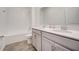 Bathroom with double vanity and tub shower combo at 6324 Chirpine Ln, Saint Cloud, FL 34771