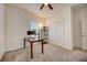 Bedroom with desk, closet, and ceiling fan at 6324 Chirpine Ln, Saint Cloud, FL 34771