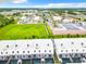 Aerial view of townhouses with private pools and surrounding businesses at 653 Trikomo Dr, Davenport, FL 33896