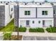 Modern townhouses with grassy yards and parking at 653 Trikomo Dr, Davenport, FL 33896