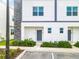 Modern townhouse exterior with stone accents at 653 Trikomo Dr, Davenport, FL 33896