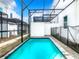 Enclosed private pool with patio and lounge chairs at 653 Trikomo Dr, Davenport, FL 33896